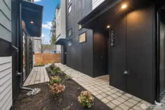 Another angle reveals thoughtful exterior lighting that welcomes you home after late dinners on nearby Westlake Avenue. Photos are of model home 2009B.