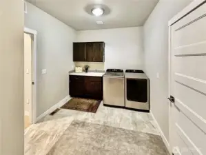 Huge laundry room and additional storage area.