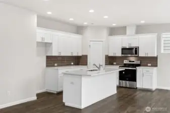 **Photos are of the same floorplan in another community. Some colors and features will cary**