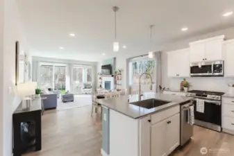 Open-concept layout connecting kitchen, dining, and living spaces for everyday comfort and entertaining.