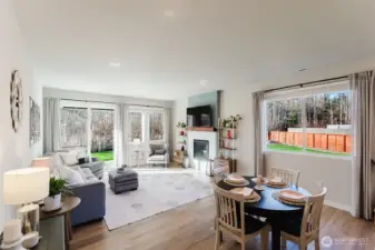 Dining space positioned between kitchen and living areas, ideal for everyday meals or entertaining.