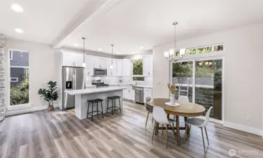 Open layout connecting kitchen, dining, and living areas for flexible use.