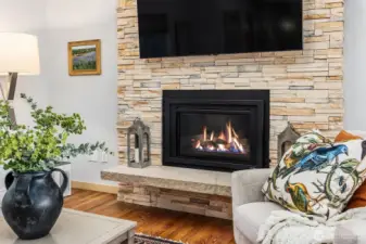 This gorgeous, floor to ceiling stacked stone fireplace and hearth are part of the home's recent updates.