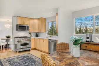 The kitchen has ample space for informal dining and your morning espresso or tea.