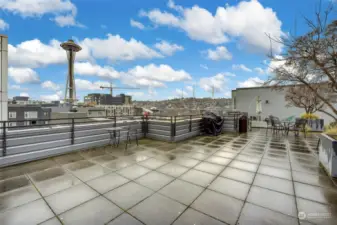 Relax on top of building with close up view of Space Needle