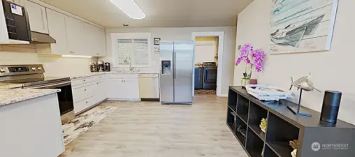 Bright and airy kitchen, with newer stainless steel appliances