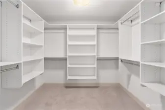 Primary bedroom walk in closet.