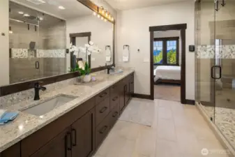 Primary bath boasts quartz countertops, 2 sinks, heated floors, steam shower, walk-in closet and Toto heated bidet toilet.
