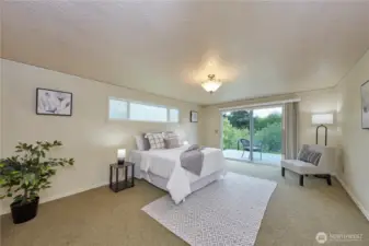 Primary bedroom with rear deck access