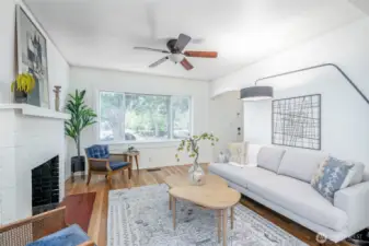 Our sellers commented that this living room stays cool in the summer months due to the lovely shade from the trees out front.