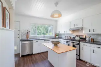 This pretty kitchen has plenty of counter space a convenient island.