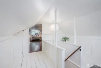 This landing could be used for an office, reading nook, or extra closet space.