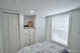BEDROOM WITH BUILT IN CABINETS, DRAWERS AND MINI SPLIT FOR HEAT AND AIR