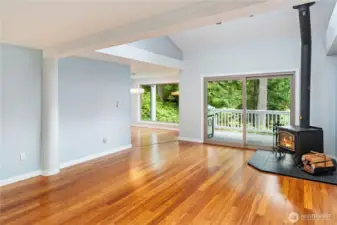 The same room as the prior photo, without stating. Light, bright and spacious, this main living room is lovely. Note the covered deck, and the propane barbecue conveys with the condo.