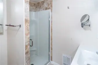Walk-in shower in the primary bedroom's private bath.
