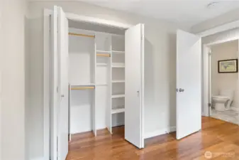 The custom closet in the guest bedroom is very functional. Across the hallway is the full guest bathroom.