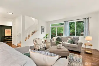 Living area off kitchen, view to fully fenced, private backyard and stairs.