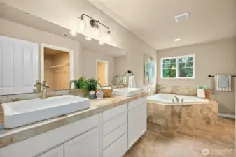 Upstairs gorgeous primary ensuite. Double sinks, large vanity, huge soaking tub, large walk in closet and separate shower and toilet area.
