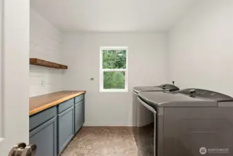 Upstairs full laundry room. Tons of space.