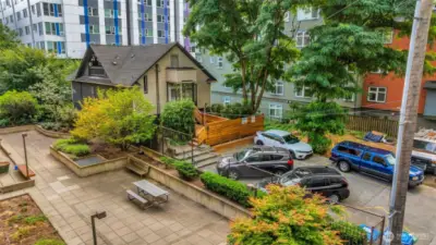 Five surface parking spaces fully rented for up to $190 each a month. Patio in picture is part of neighboring property.