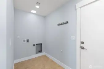 Main floor laundry area gives easy access for everyday convenience.