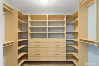 Custom Walk-In Closet – Thoughtfully designed with built-ins for organized storage.
