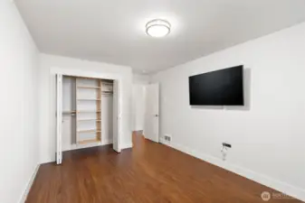 2nd lower level guest room with built-ins in closet and TV included.