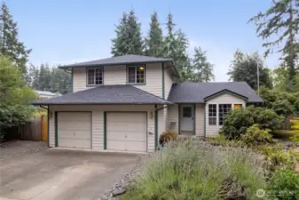 Welcoming home with 2 car garage and brand new roof with transferable warranty!