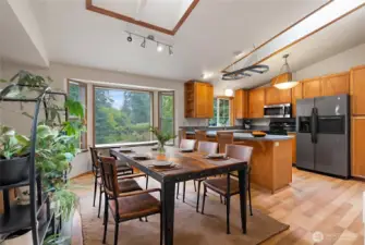 Love the bay window in the dining area! This photo has been virtually staged with the dining table and rug.