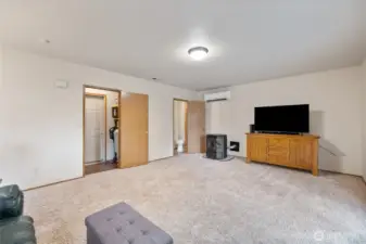 There is a half bath off the family room and a utility room, currently used as a pantry. Washer/dryer hookups are still there, so this could be used as a utility room again. The door to the garage is located here.