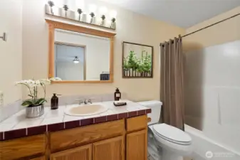 Primary bathroom is virtually staged.