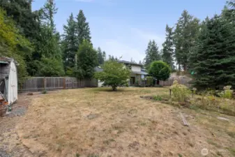 You can have that garden you've always dreamed of here! There is also a drive through gate in the fence that can be seen in this photo.