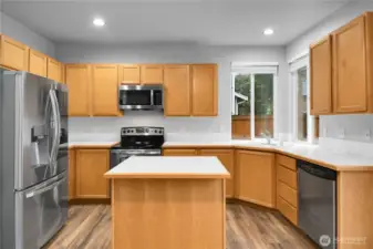 Kitchen with stainless steel appliances & LVP flooring