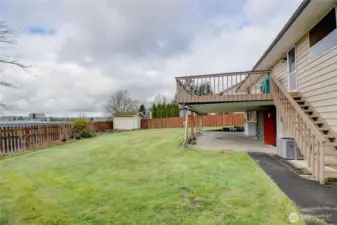 Fully fenced back yard with toold shed. Covered patio below deck.