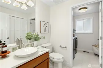 Powder Room attached laundry room and plenty of storage