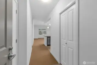 Front entrance with laundry room to the left and coat closet to the right.