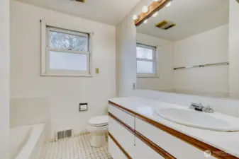 Main Floor Full Bath. Separate shower enclosure to the left of the tub (not seen in this photo).