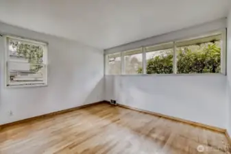 Bedroom #2 on Main Floor. As you can see, plenty of natural light here with that wall of windows.