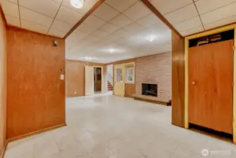 Rec Room/Game Room in Daylight Basement. The door to the right is the furnace closet.