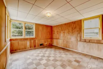 Large Bedroom in Basement with en suite 3/4 bath. Original wood parquet floor and wooden walls. Tons of windows for plenty of natural light. This room is tucked away from the rest of the home and was used as the seller's office.