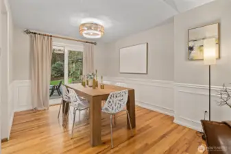 Sliding doors off dining room lead to backyard patio.