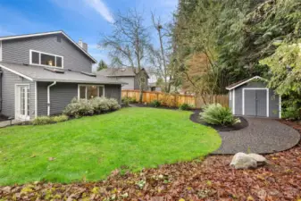 Level lawn backs up to greenbelt.