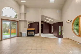 Dining area w/propane fireplace and   access to patio and family room