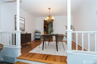 Positioned conveniently between the kitchen & living room, spacious dining room, accented with hardwood floors (digitally staged)