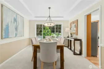 Formal dining room off living room connecting to kitchen.