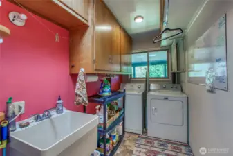 Laundry with oversized sink and additional storage