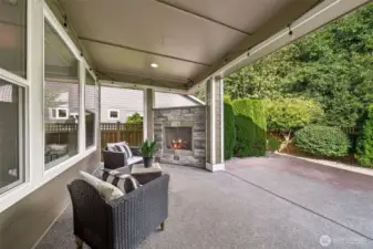 Covered patio with gas fireplace.