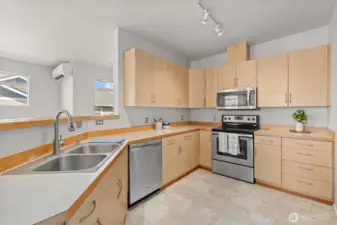 Unusually roomy kitchen with stainless appliances