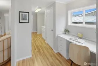 Built-in coffee bar/desk with quartz counter and glass backsplash