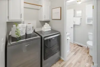 Full-size washer and dryer with storage and sink